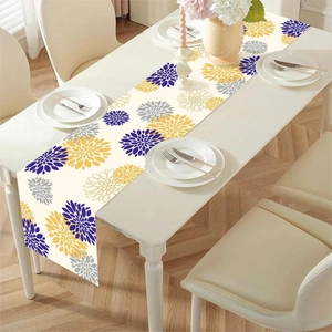 Floral butterfly table runner with abstract blue and yellow flowers on white wood table