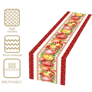 Christmas table runner with red ornaments and green leaves pattern on polyester fabric