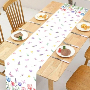 Floral spring table runner with tulips and butterflies on a rustic wooden dining table