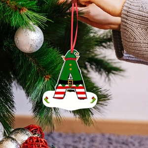 Christmas elf letter A ornament with hanging ribbon on a decorated festive pine tree