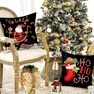 Christmas pillow covers featuring Santa Claus and stockings for holiday home decor