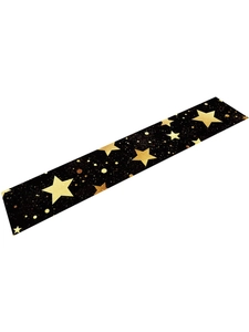 Close-up of black Christmas table runner with festive gold star and dot patterns