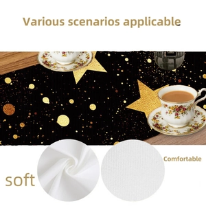 Christmas table runner with gold star patterns on black fabric for holiday dining decor