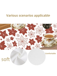 Close-up of soft white Christmas table runner showing delicate leaf patterns and fabric texture