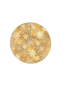 Detail of gold Christmas tree skirt featuring sparkling white snowflake patterns