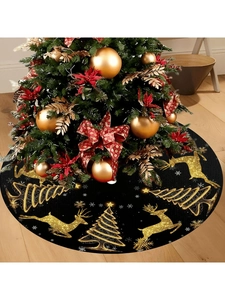 Close-up of black Christmas tree skirt featuring golden glitter reindeer and snowflake patterns