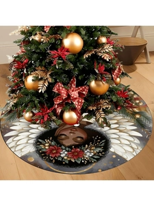 Detail of a Christmas tree skirt with an elegant black angel design and red floral patterns