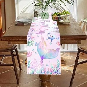 Mermaid birthday table runner featuring pink and purple fish tail and dolphin motifs