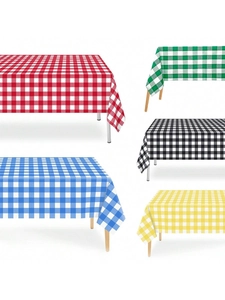 Detail of colorful gingham tablecloths showing red, green, and blue checkered patterns