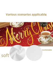 Detail of red Merry Christmas table runner with golden text and soft fabric texture