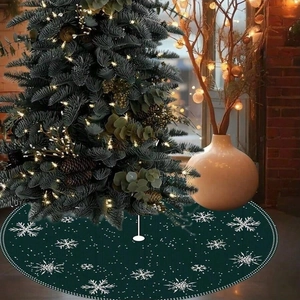 Green Christmas tree skirt with white snowflake patterns and elegant holiday decor