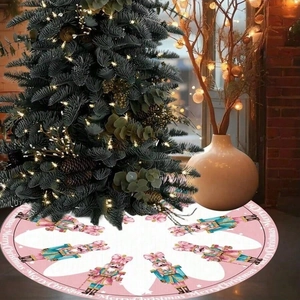 Pink Christmas tree skirt featuring nutcracker soldiers and Merry Christmas text decor