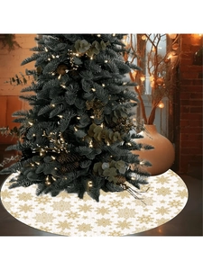 Detail of white Christmas tree skirt with golden snowflake patterns in festive room setting