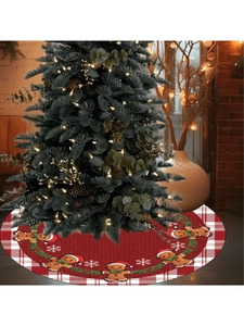 Detail of red plaid Christmas tree skirt with gingerbread man and snowflake patterns