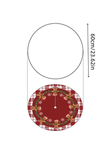 Detail of red plaid Christmas tree skirt with gingerbread man and snowflake patterns
