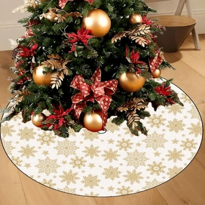 White Christmas tree skirt with golden snowflake patterns on a rustic wooden floor