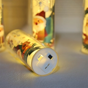 Close-up of LED Christmas candle base with battery compartment and power switch