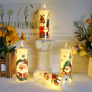 Macro view of LED Christmas candles with Santa and Reindeer prints on acrylic shells