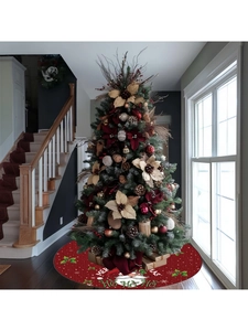 Detailed view of red Christmas tree skirt with Santa Claus motif and festive patterns
