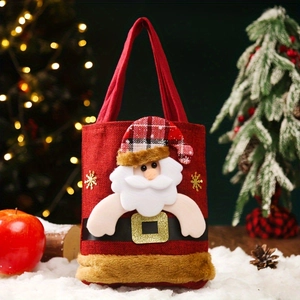Detail of red burlap Christmas gift bag featuring a 3D Santa Claus applique and plush trim