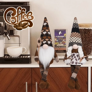 Pair of decorative coffee gnomes with heart knit hats and coffee bean aprons in kitchen