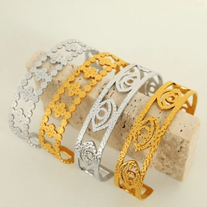 Vintage gold and silver hollowed titanium steel bangles with hammer texture detail