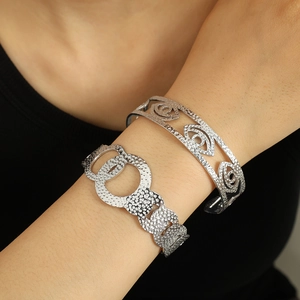 Hammered silver textured open cuff bracelets with hollow evil eye and geometric designs