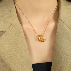 Polished gold crescent moon pendant necklace with sleek snake chain for women