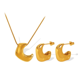 18K gold plated titanium jewelry set featuring hollow horn pendant necklace and stud earrings