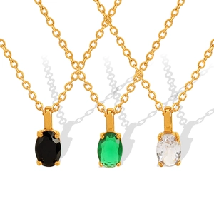 Elegant gold necklace set with black, green, and clear oval zircon pendants in minimalist style