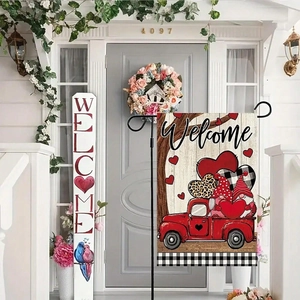 Close-up of Valentine garden flag with red truck and gnome design on a front porch