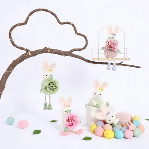 Easter bunny plush figurines set with flowers and colorful eggs for festive decoration