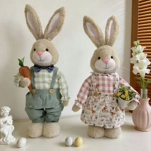 Pair of Easter bunny plush figurines with carrot and flower pot for spring home decor