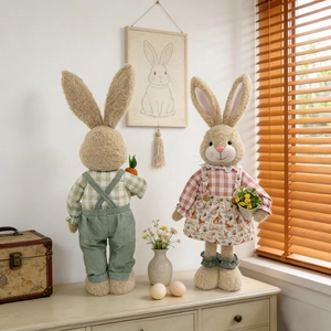 Cute Easter bunny couple plush dolls in green and pink outfits for spring home decoration