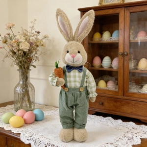Detail of Easter bunny doll with plaid shirt and carrot on a lace tablecloth