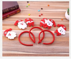 Detail view of 3 Christmas headbands with Santa Snowman and Bear on wooden desk