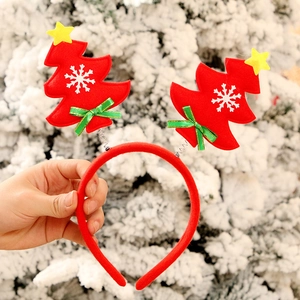 Christmas headband with red trees, white snowflakes, stars and festive green bows