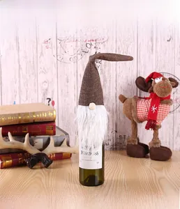 Detail of Forest Gnome wine bottle cover with knit cap and faux fur beard decoration