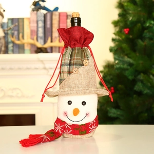 Christmas snowman wine bottle cover made of burlap with a red scarf for festive decoration