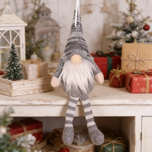 Detail of a Christmas gnome ornament with grey-white striped hat and long white beard