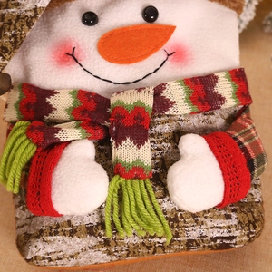 Christmas snowman candy gift bag with red striped scarf and realistic wood bark texture