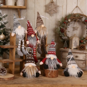Close-up of assorted Christmas gnomes with knit hats on vintage wooden stands