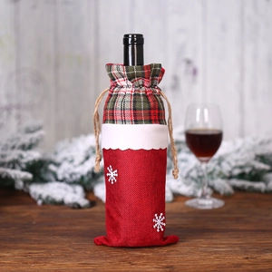 Christmas burlap wine bottle bag with red green plaid trim and snowflake details