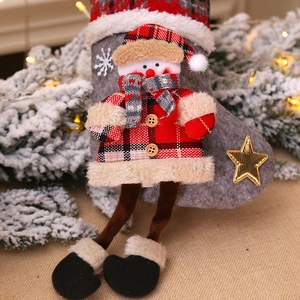 Gray felt Christmas stocking with a 3D snowman doll, plaid shirt, and long hanging legs
