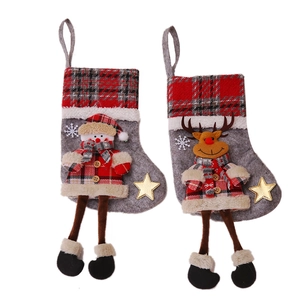 Christmas snowman and reindeer hanging stockings with red plaid and long legs for fireplace