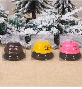Detailed view of colorful service bells with fun slogans in transparent gift packaging