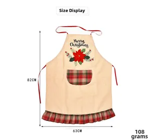 Detail view of Christmas apron with Merry Christmas embroidery and red plaid pockets