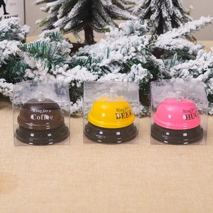 Three creative metal service call bells in colorful gift boxes for coffee, beer, and hugs