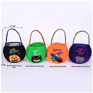 Detail of four colorful Halloween candy bags with pumpkin, witch, and black cat designs