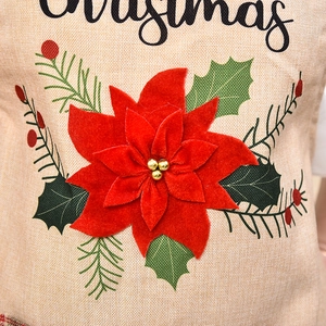 Christmas burlap apron with festive red poinsettia flower and winter holly leaf patterns